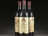 three bottles of wine sitting on top of a table next to each other