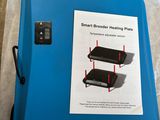 a picture of a blue plastic heat plate on a table