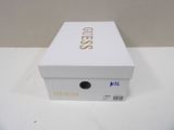 a white box with gold lettering on it on a table