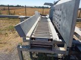 an image of a conveyor belt that is in the middle of a field