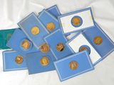 a pile of gold coins on a white table cloth