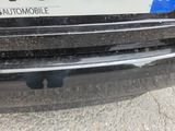 a close up of a car ' s bumper with a sticker on it