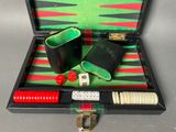 a black case with a green and red backgam set in it