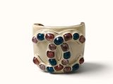 a close up of a ring with stones on it