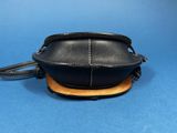 an image of a small black purse with a leather strap