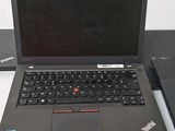 two laptops that are sitting on a table