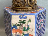 a blue and white box with a gold crown on top of it