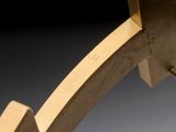 a close up picture of a clock with a wooden frame