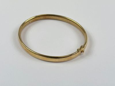 Bracelet jonc articulé en or 750 millièmes. - Photo 1