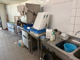 a kitchen with a sink, refrigerator, and a refrigerator in it