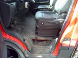 a suitcase in the back of a car with the door open