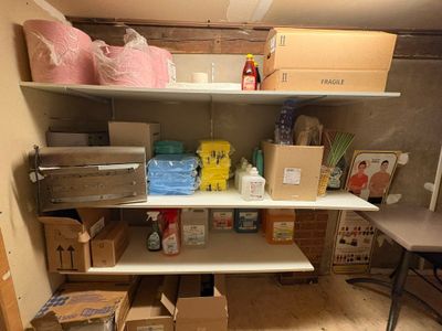 a room with a lot of boxes and boxes on the shelves