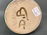 an image of a close up of a plate with writing on it