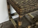 an image of a wicker stool in a room