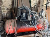 a small air compressor sitting on top of a table
