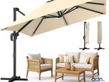 une photo d'un ensemble de mobilier de jardin comprenant un parasol et une table basse