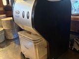 a coffee maker sitting on a counter in a kitchen