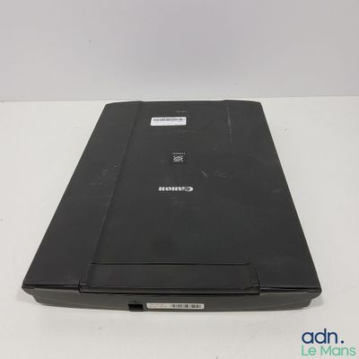 a black laptop sitting on a white table