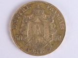 an old coin with a coat of arms on it on a white surface