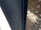a metal door with a hole in the middle of it