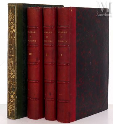 three old books sitting on top of each other on a table