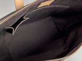 the inside of a handbag with a zipper on the inside