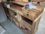 a wooden table with a drawer on top of it