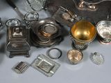a lot of silver items that are on a table