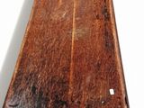 a wooden bench that is sitting on a white surface