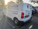 a white van that is parked in a parking lot