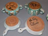 three cups and a saucer on the table