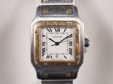 a close up of a wrist watch with roman numerals on it