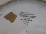a white plate with a brown tag on it