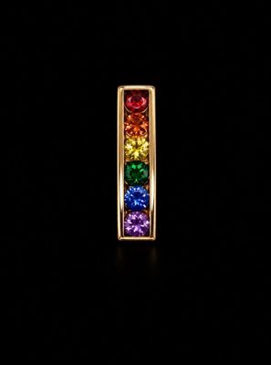 a close up of a rainbow colored necklace on a black background