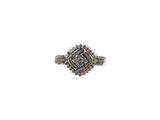 a close up of a diamond ring on a white background