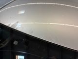 a close up of a car ' s hood with the hood down