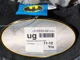 the back of a batman costume with a tag on it