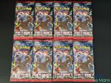 Six paquets de cartes à collectionner Pokémon sont posés sur une table