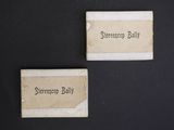 two small tags on a black surface that say stressop ball