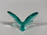 a small glass object that is sitting on a table