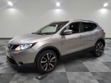 the silver nissan suv is parked on a checkered tile floor