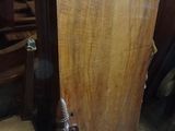 a wooden door with a metal handle in a room