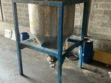 a large metal tank sitting on a stand in a garage
