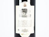a bottle of wine that is sitting on a table