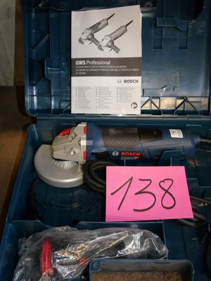 a blue box with tools and a pink sign in it
