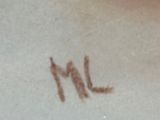a picture of a cat that is writing on the paper