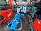 two machines that are next to each other on the street