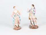 pair of porcelain figurines of a woman and a man