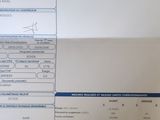 un document sur lequel figure une photo de voiture