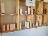 many wooden shelves that have different types of items on them